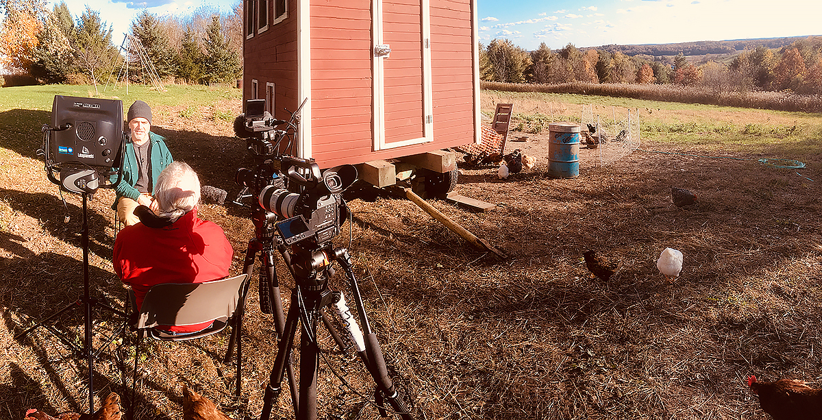 Michael Perry tells stories outside of his chicken coop on a sunny fall day