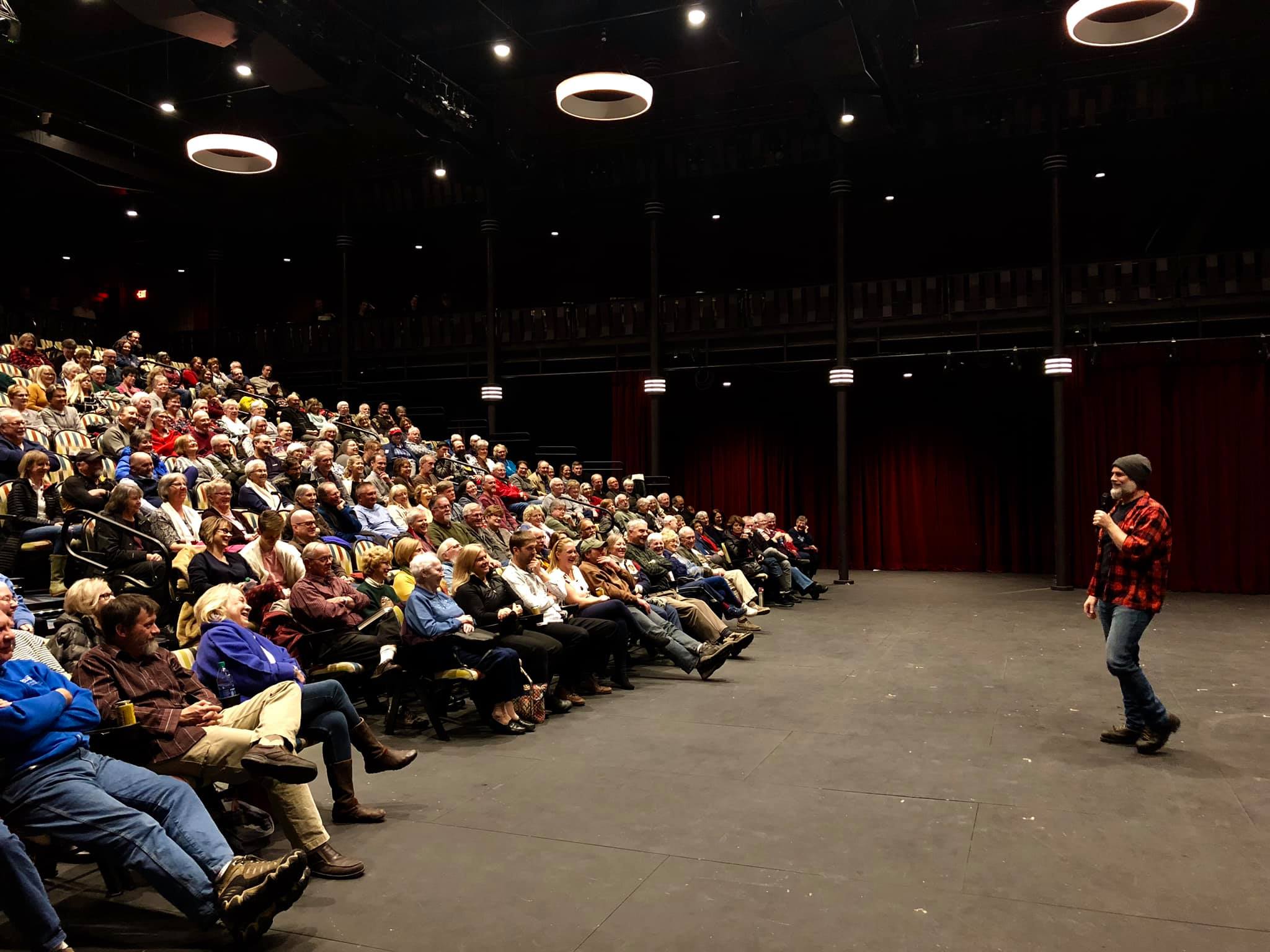 Michael Perry speaks to a packed auditorium