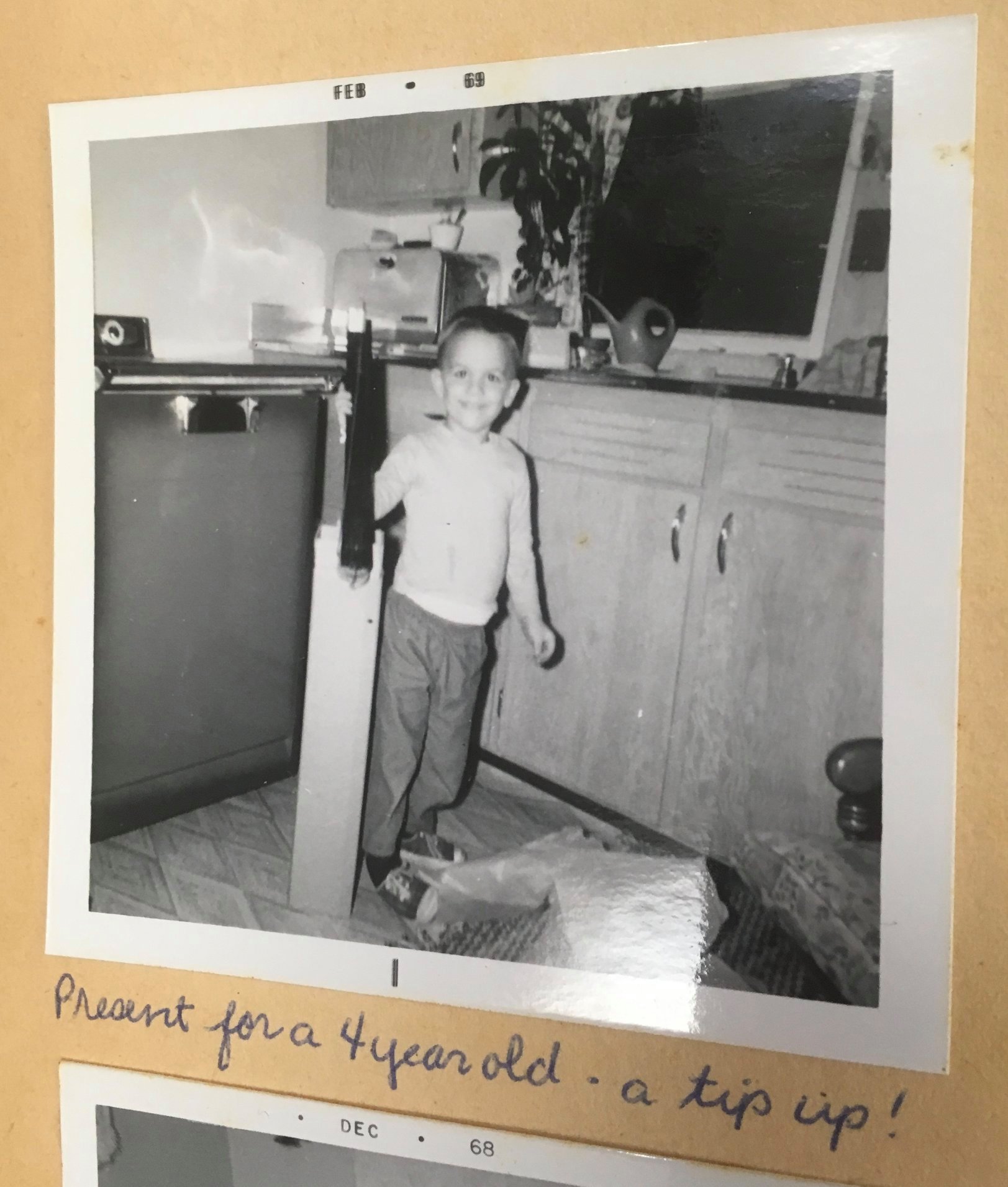 Four-year-old Michael Perry poses with an ice fishing tip up