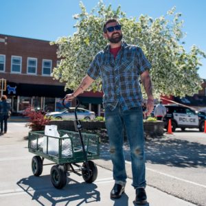 Luke Zahm pulls a wagon filled with produce through Viroquas downtown