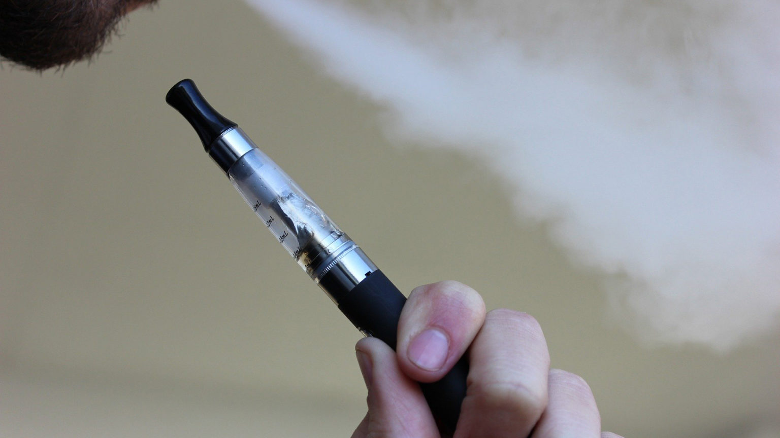 Image of a person using a vape pen.