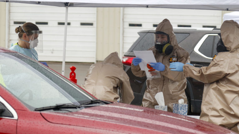 Three Wisconsin National Guard Soldiers and Airmen and one local medical professional help facilitate mobile testing in Buffalo County, Wis., May 1, 2020. Wisconsin National Guard Soldiers and Airmen provide COVID-19 testing alongside county Emergency Management and County Health Officials in support of the Department of Health Services request in Buffalo County, Wisconsin.  (Courtesy: Spc. Emma Anderson / Wisconsin National Guard)