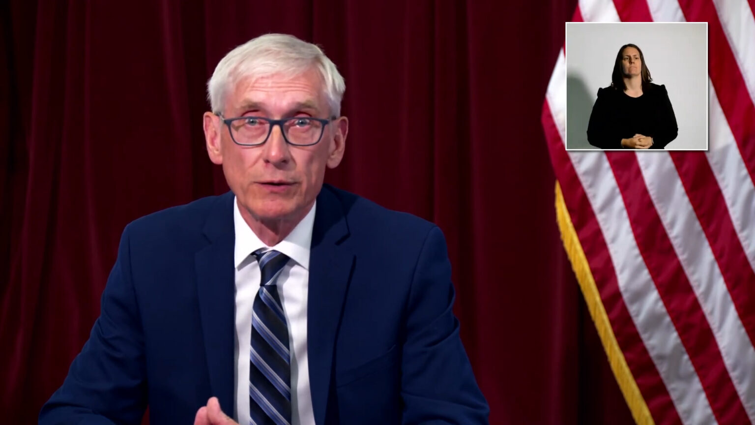 Gov. Tony Evers delivers a speech during a media briefing with the Department of Health Services.