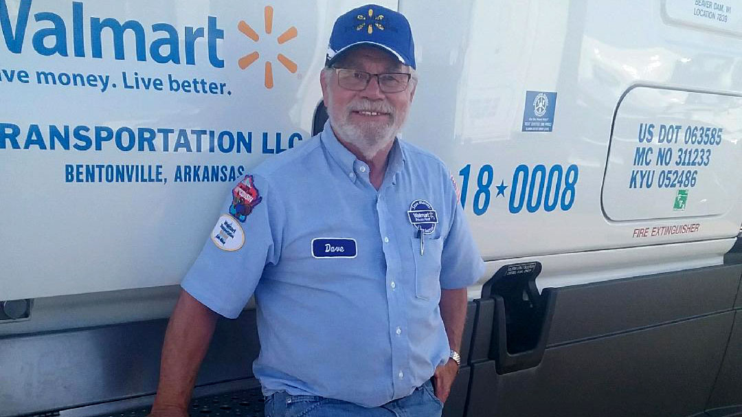 Truck driver standing next to Walmart truck