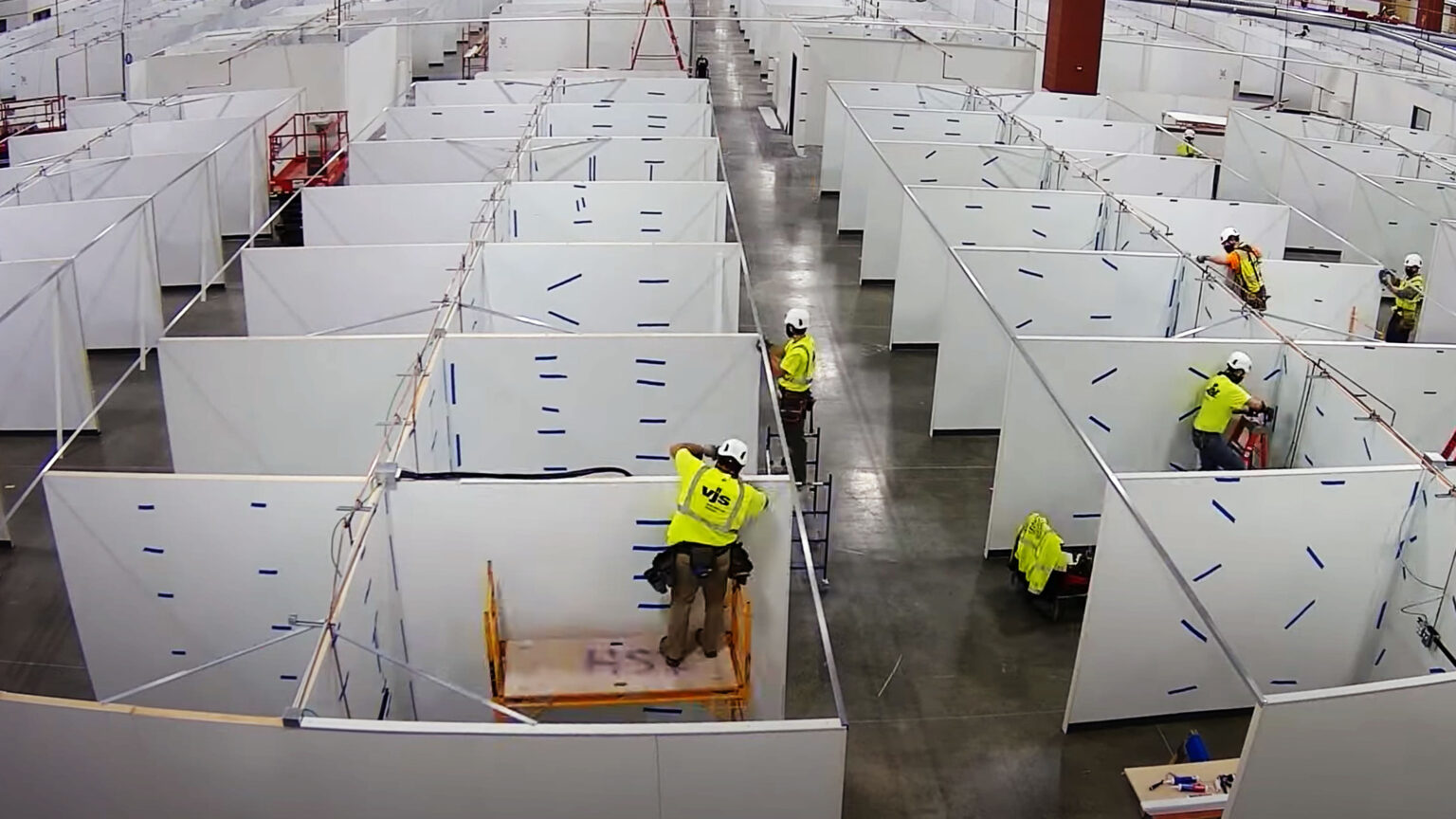 Workers build an alternative care facility at State Fair Park in West Allis as COVID-19 cases overwhelm the state's hospital system. (Courtesy: Wis. Dept. of Administration)