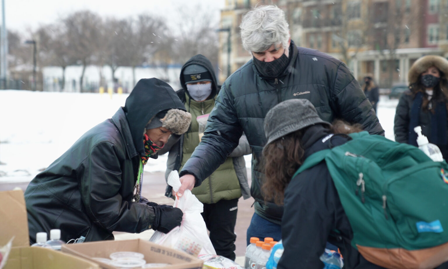 Volunteers sort food and clothing during a Justice for Jacob Blake, antifascist mutual aid action event at McPike Park in Madison.