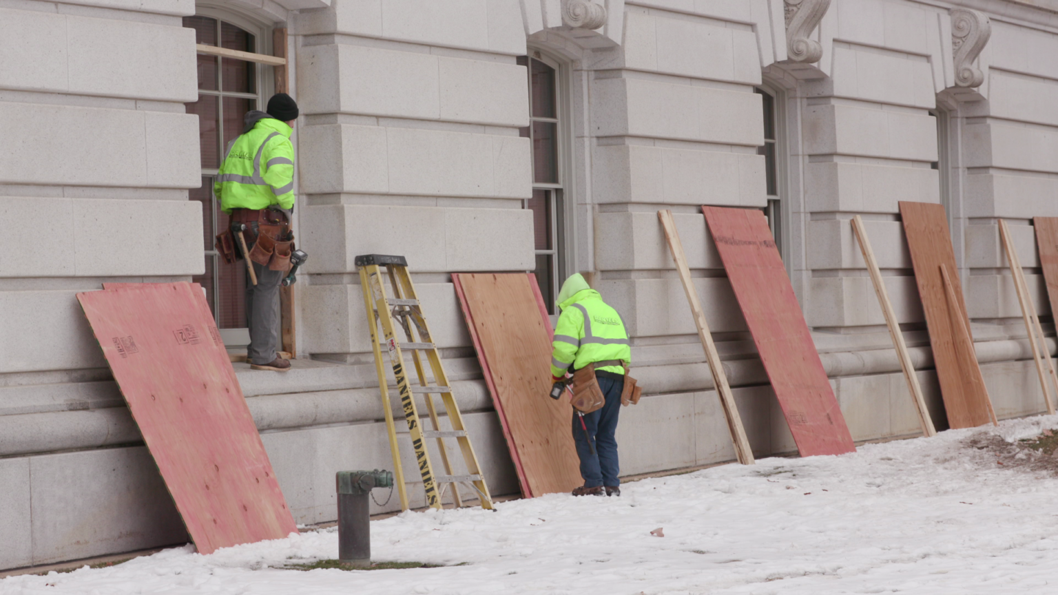 Workers board up Capitol