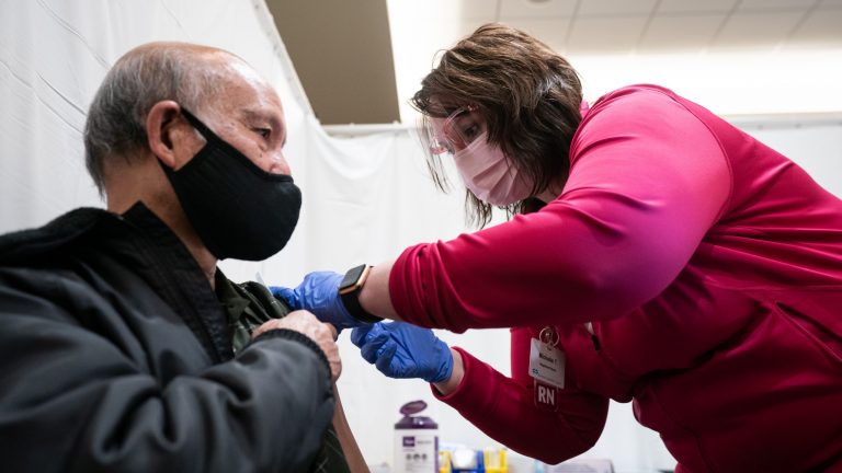 A nurse with Advocate Aurora Health administers COVID-19 vaccine to a Winnebago County resident at the community vaccination center at the Culver Family Welcome Center on the University of Wisconsin-Oshkosh campus on Feb. 19, 2021.