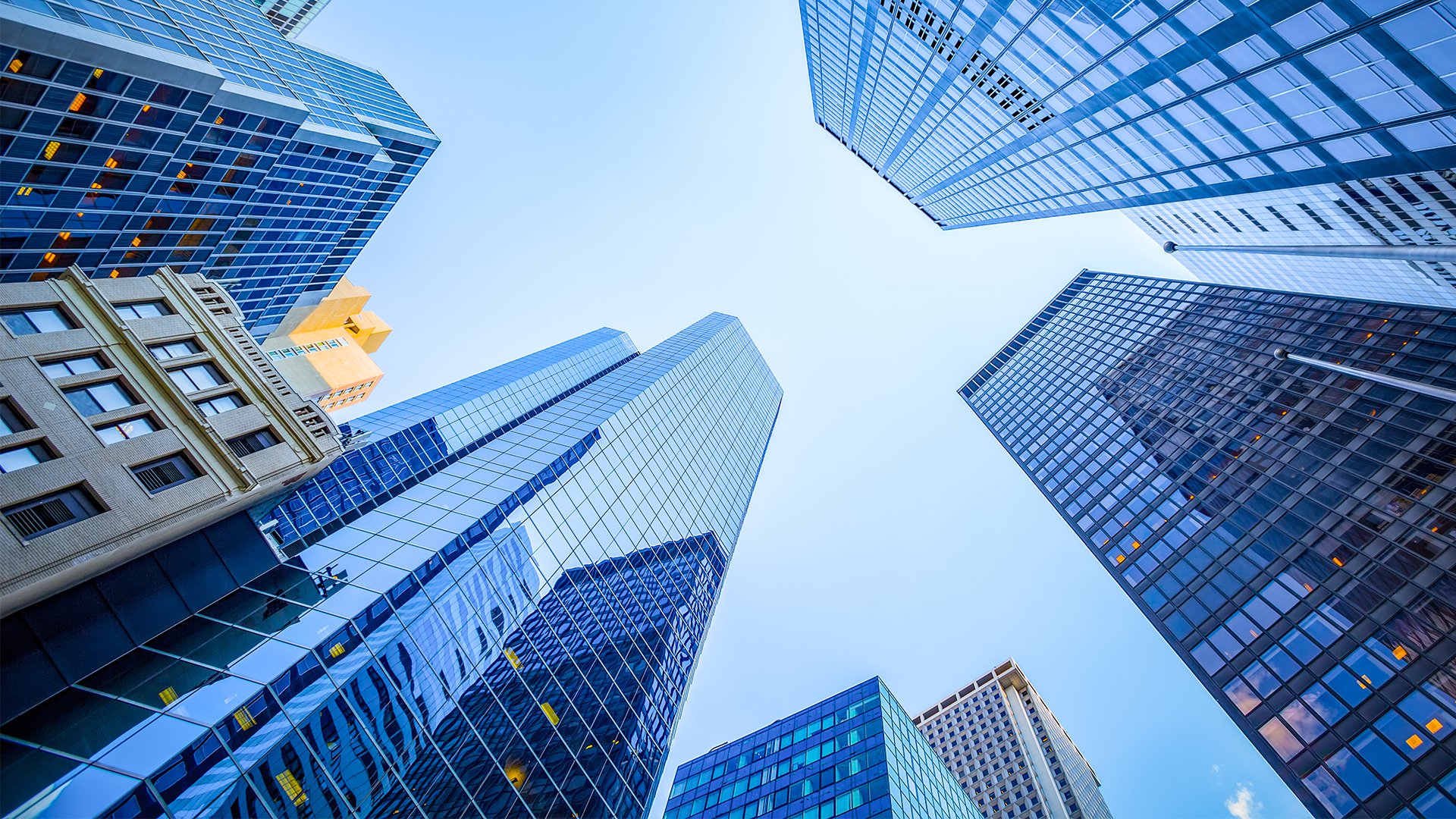 looking up at skyscrapers