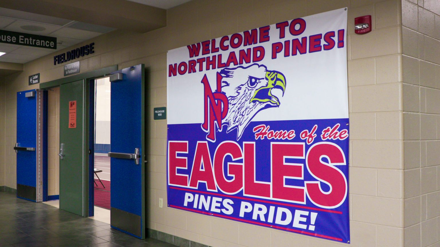 Northland Pines Home of the Eagles banner in high school hallway