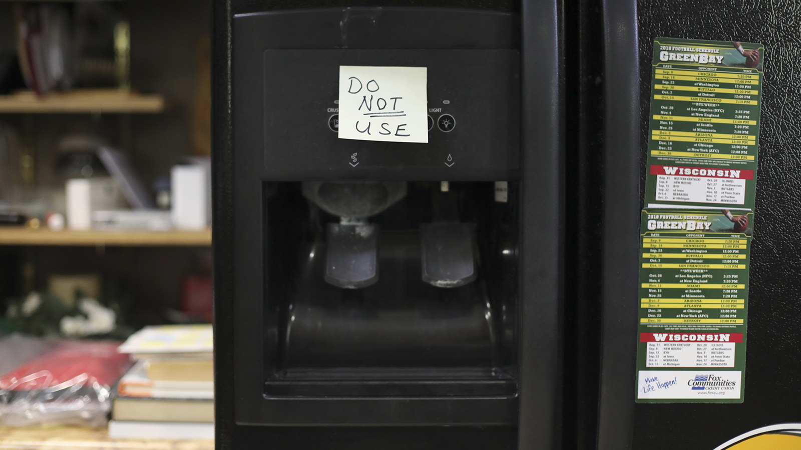 Post-It Note reading "Do Not Use" on refrigerator water dispenser