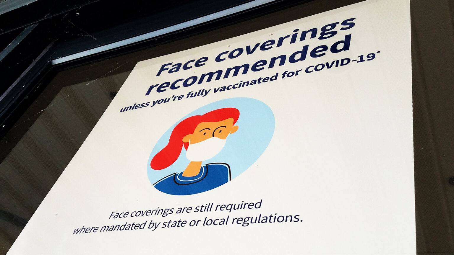 A window reads Face coverins recommended unless you're fully vaccinated for COVID-19 — Face coverings are still required where mandated by state or local regulations.