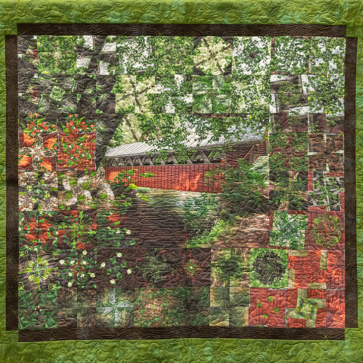 Bridge at the Red Mill quilt, featuring many shades of green