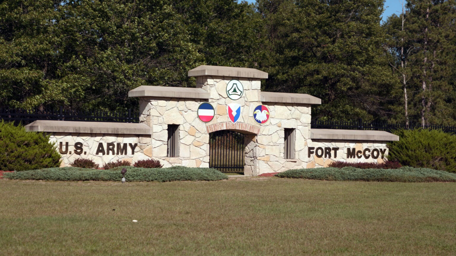 A stone gate marks the entrance to the U.S. Army installation Fort McCoy.
