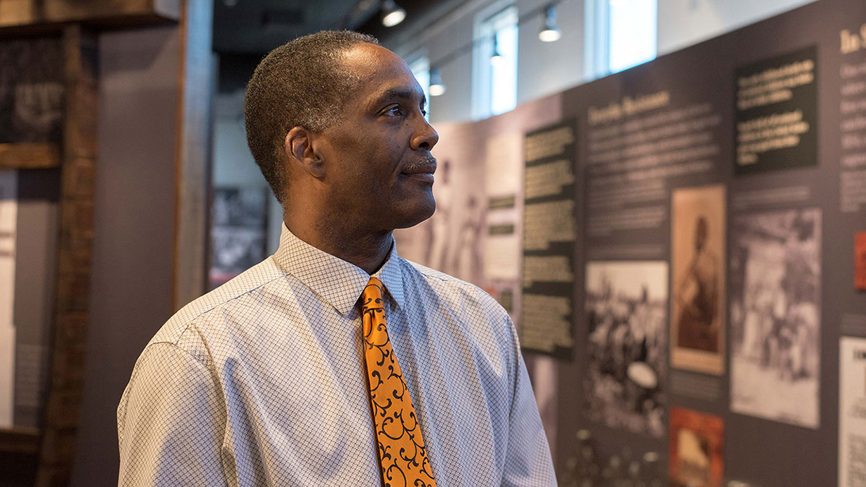 Reggie Jackson looks at a display at America's Black Holocaust Museum.