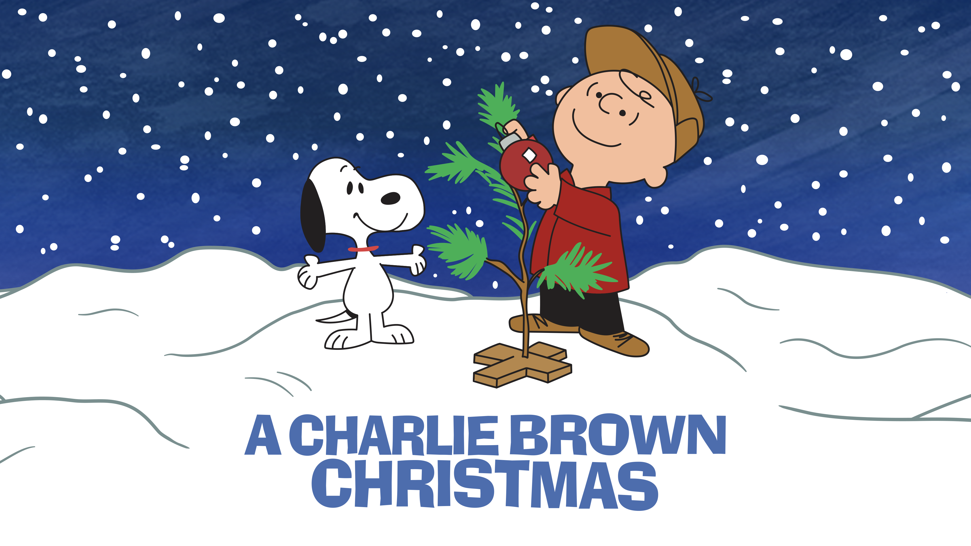 charlie brown and snoopy standing in snow with small christmas tree