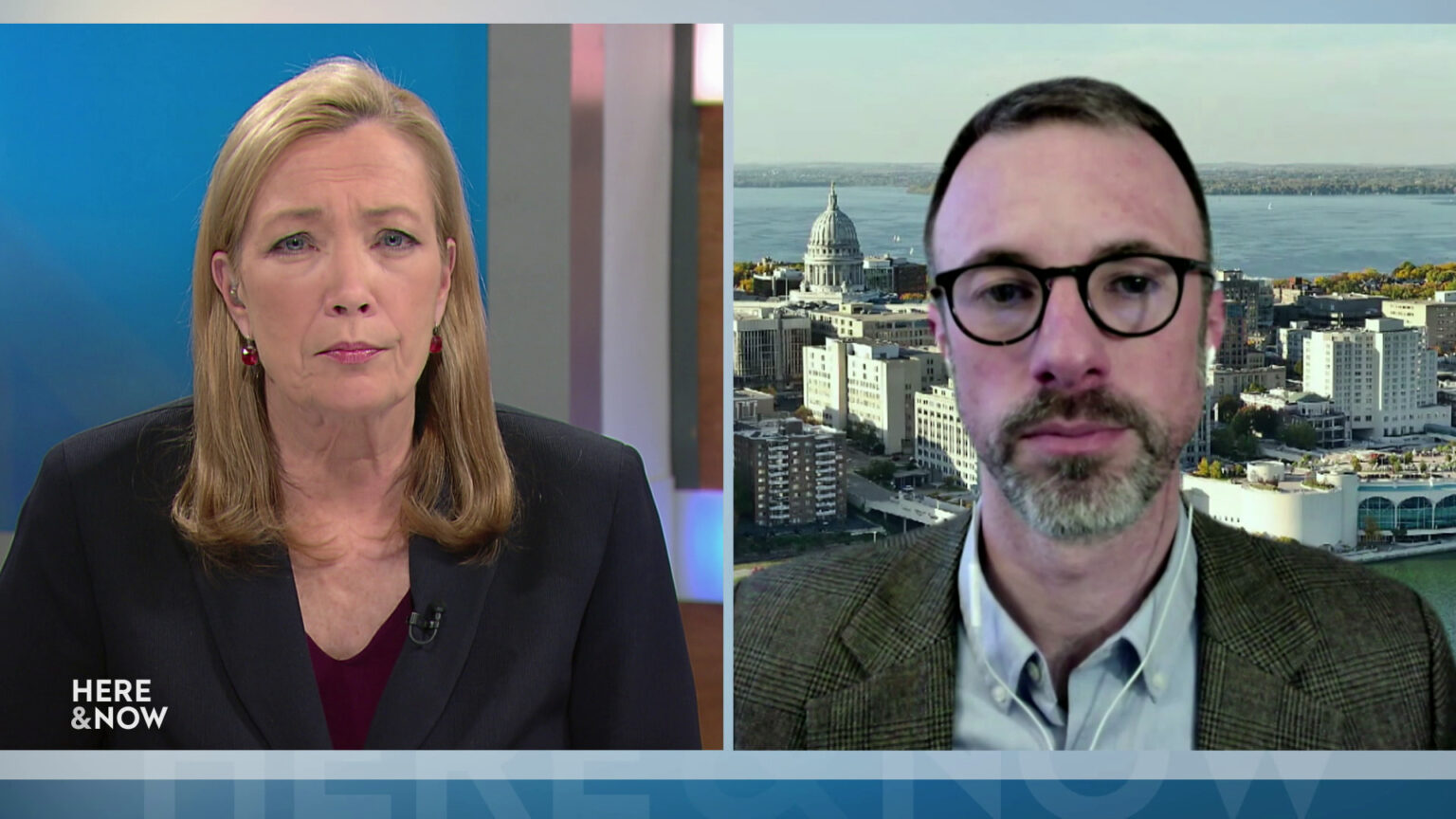 From left to right, a split screen with Frederica Freyberg and Barry Burden seated in different locations