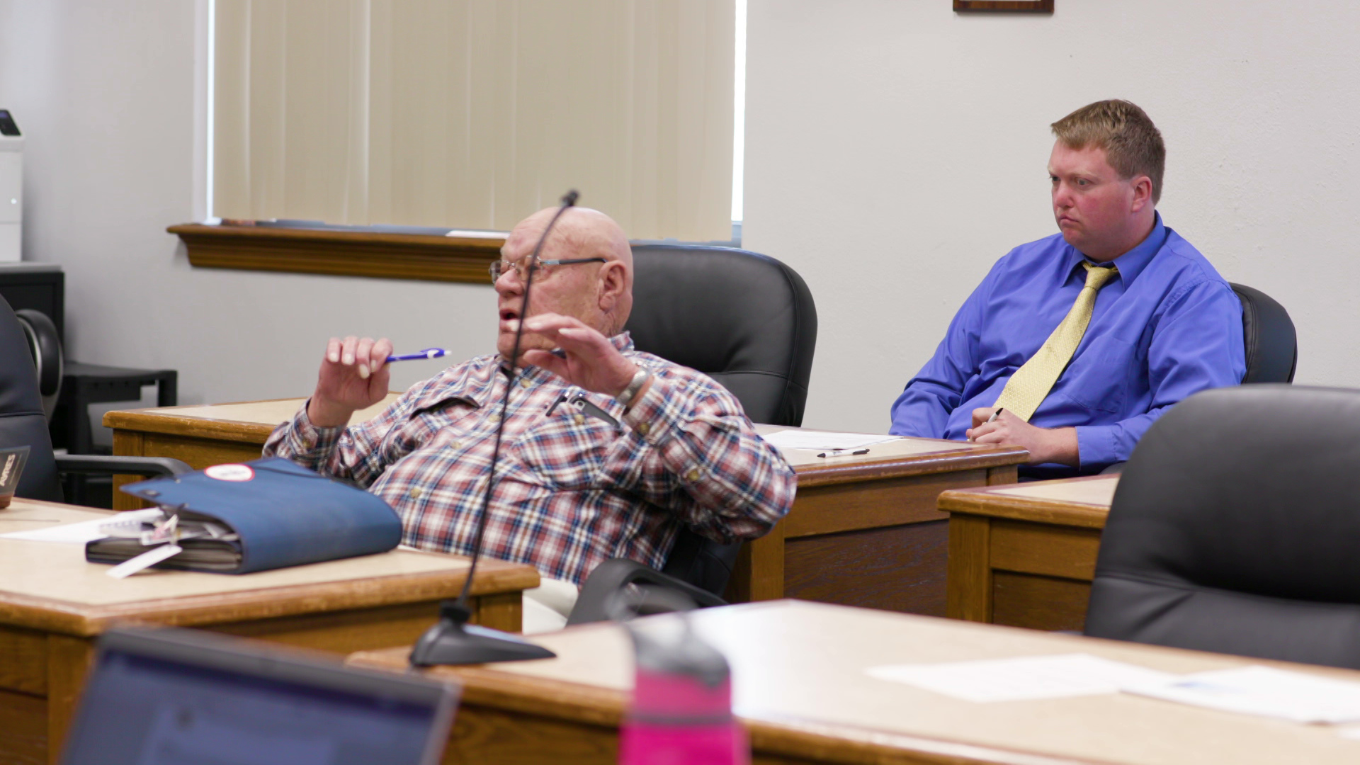 Max Hart listens while seated at his desk at a meeting of the Jackson County Board of Supervisors.