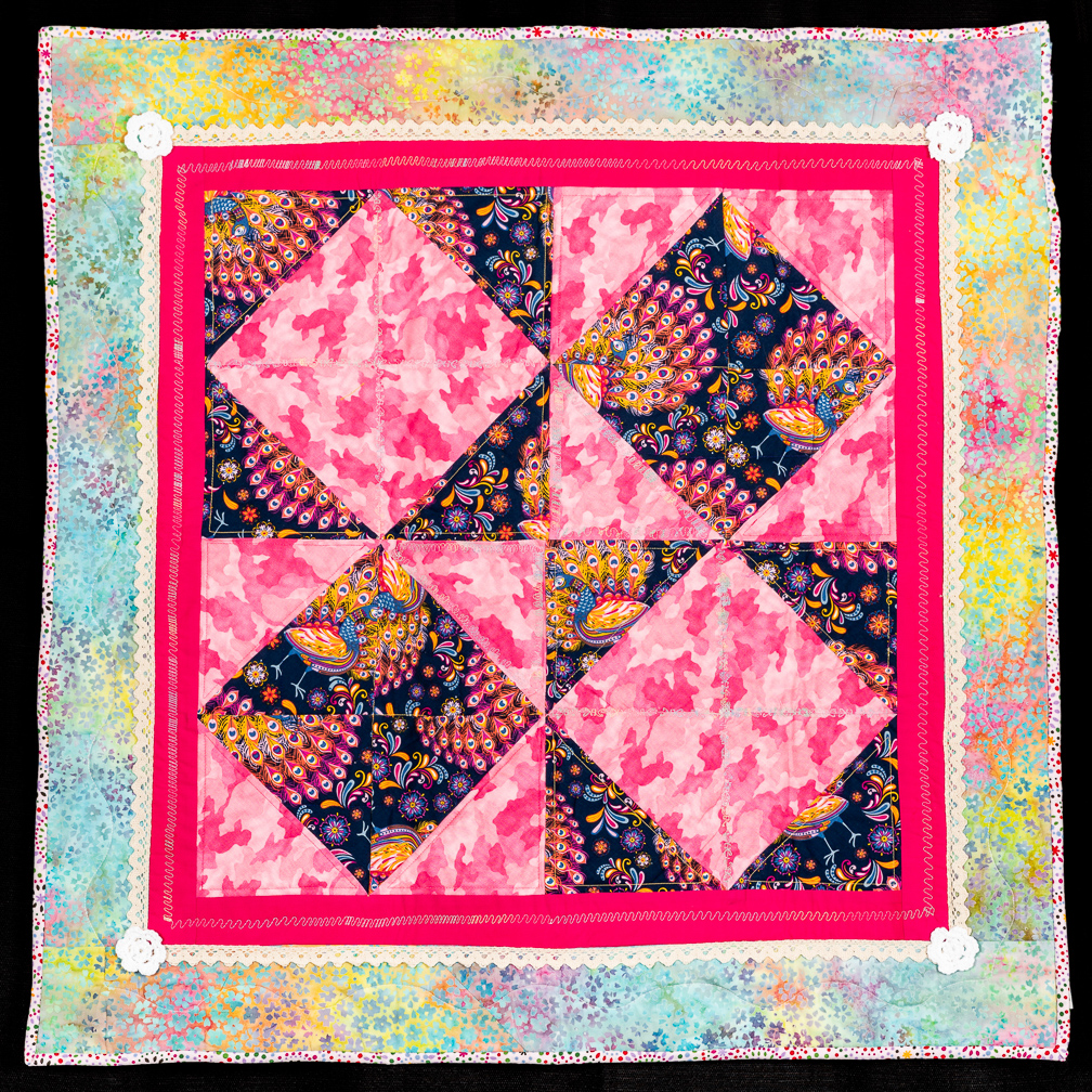 A colorful quilt set with four diamonds