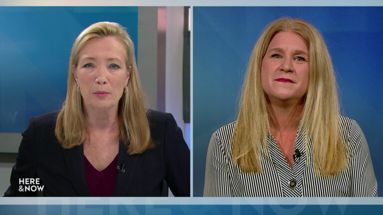 A split screen shows Frederica Freyberg and Amy Loudenbeck on the Here & Now set.