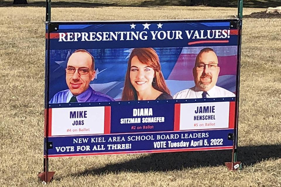 A printed political yard sign for three Kiel school board candidates — Mike Joas, Diana Sitzman Schaefer and Jamie Henschel — reads "Representing Your Values!"