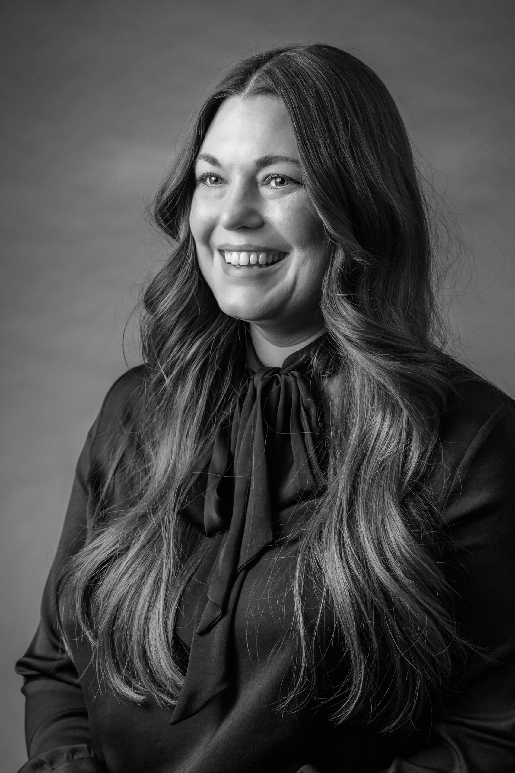 Black and white portrait of Director of Corporate Sponsorships, Adrienne Palm