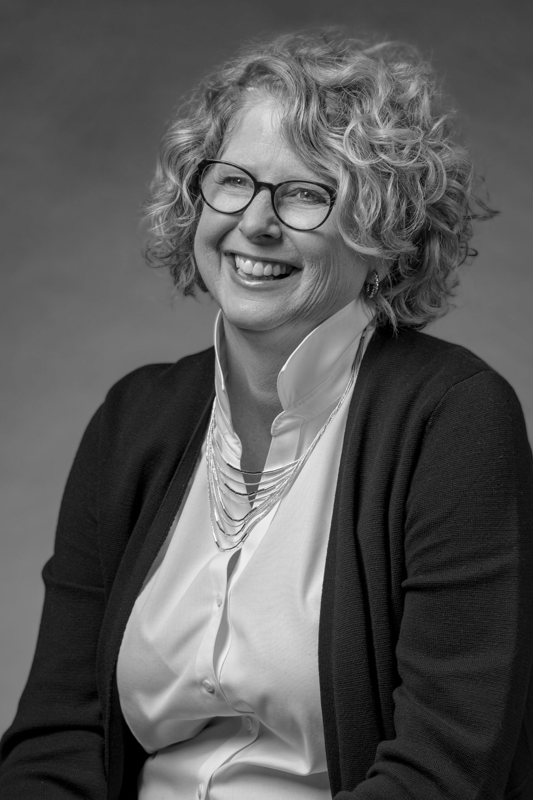Black and white portrait of Friends of PBS Wisconsin Finance Manager, Lorrie Goodwin
