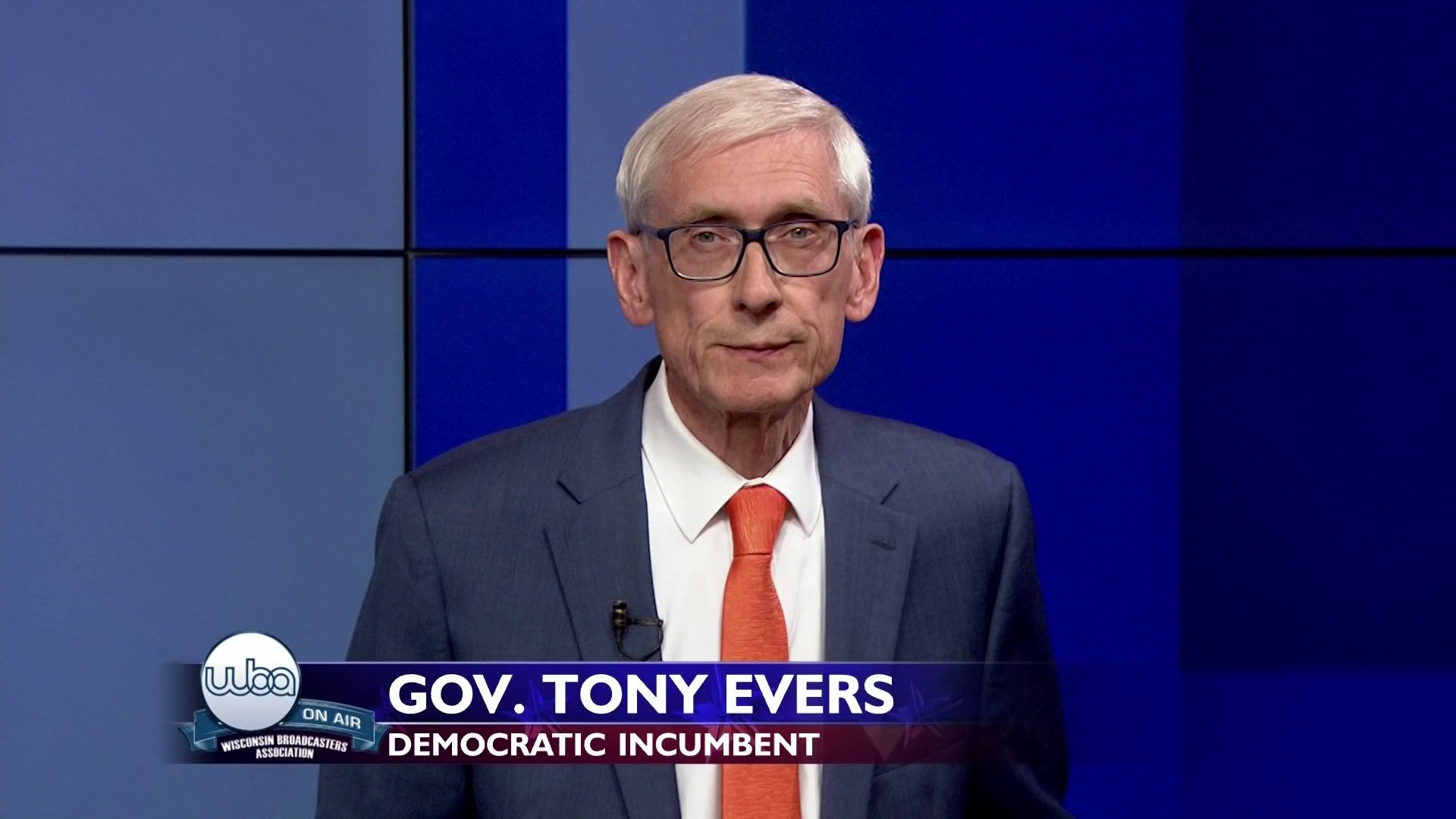 Tony Evers faces a camera during a televised debate.