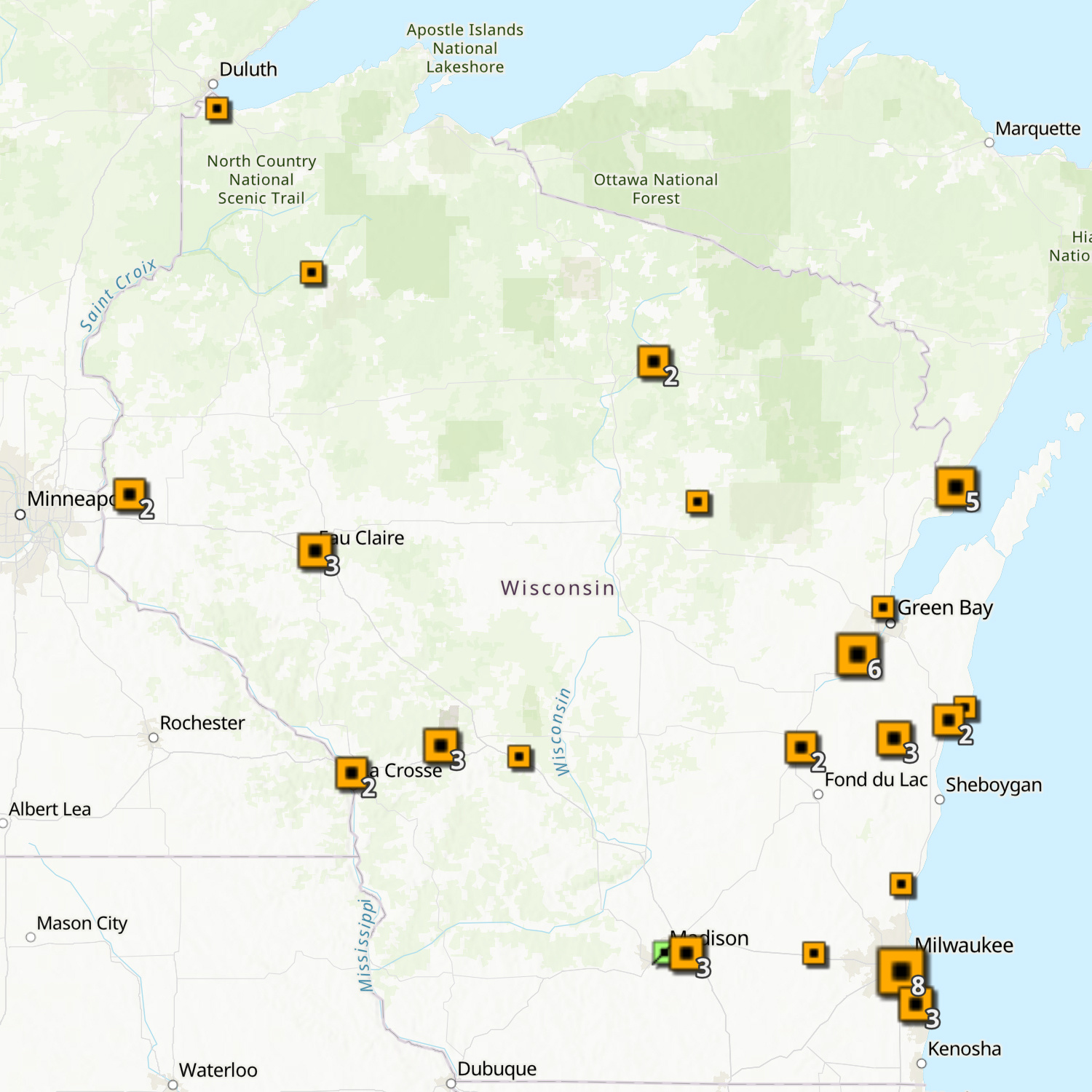A map of Wisconsin features squares of different sizes indicating the location of PFAS contamination investigations.
