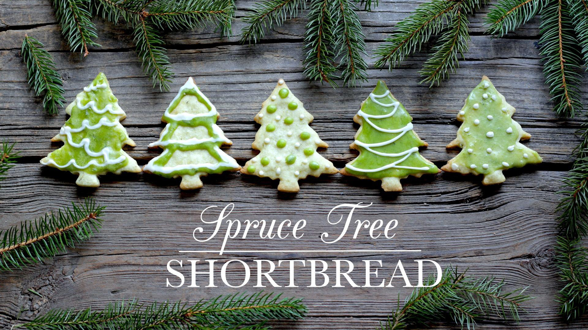 Christmas tree shaped cookies covered with green and white icing.