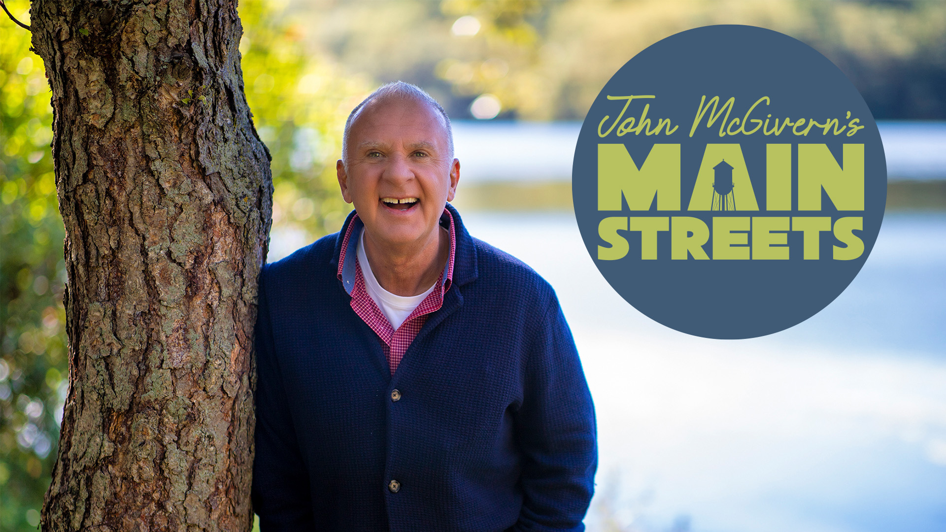 John McGivern standing next to a tree and Main Streets show logo.