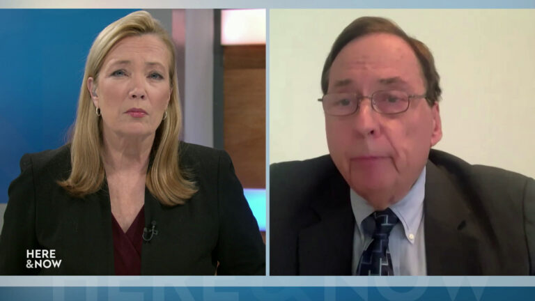 A split screen shows Frederica Freyberg and Robert Spindell in different locations.