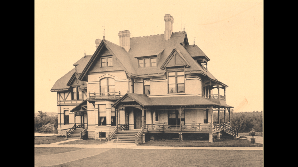 An archival photo of a victorian style mansion