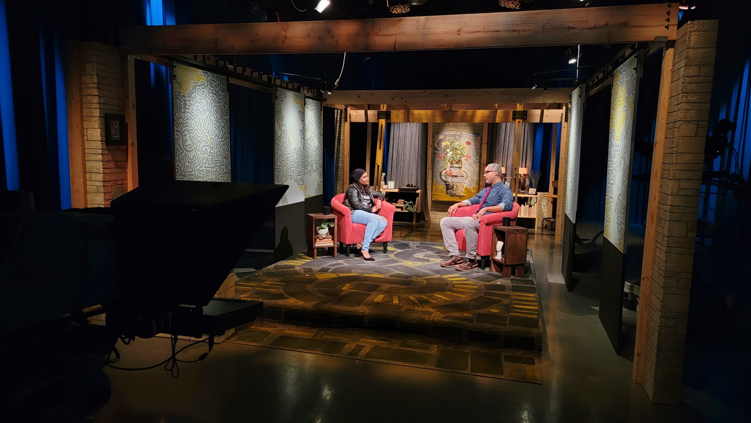 A photograph of the PBS Wisconsin Why Race Matters studio with host Angela Fitzgerald interviewing Anwar Floyd-Pruitt