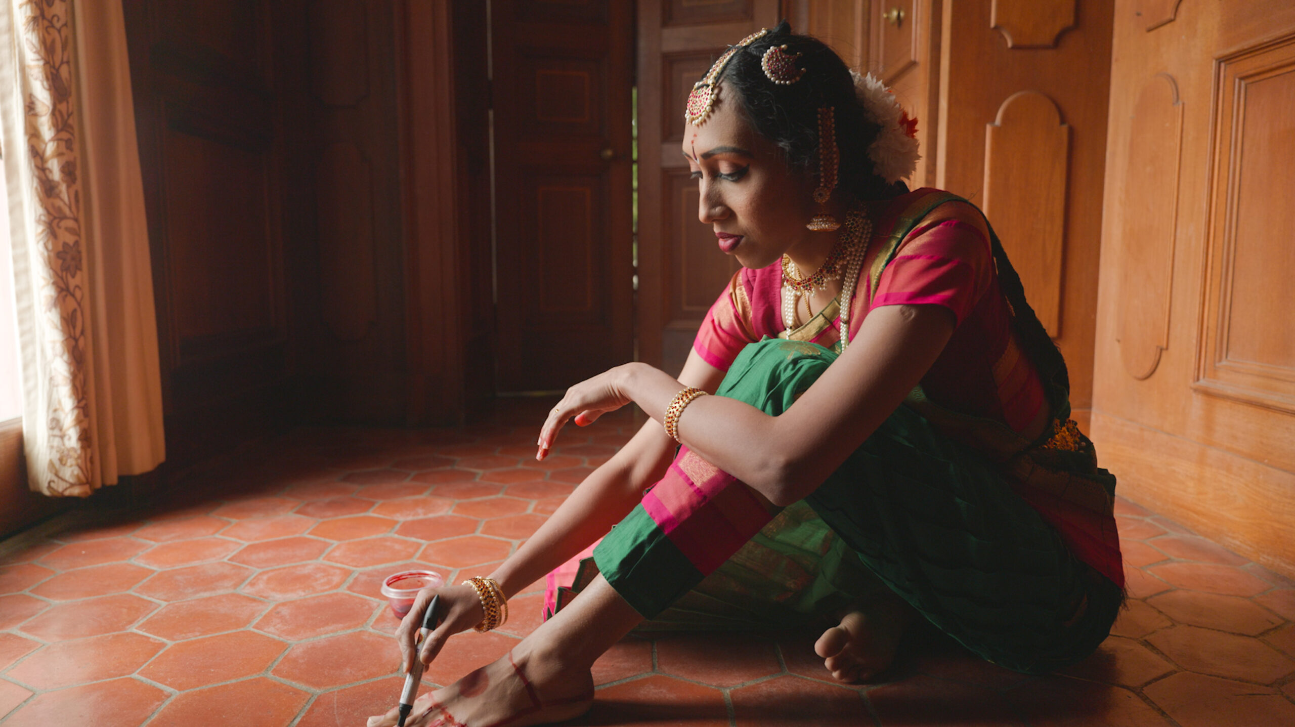 A woman prepares to perform a song and dance