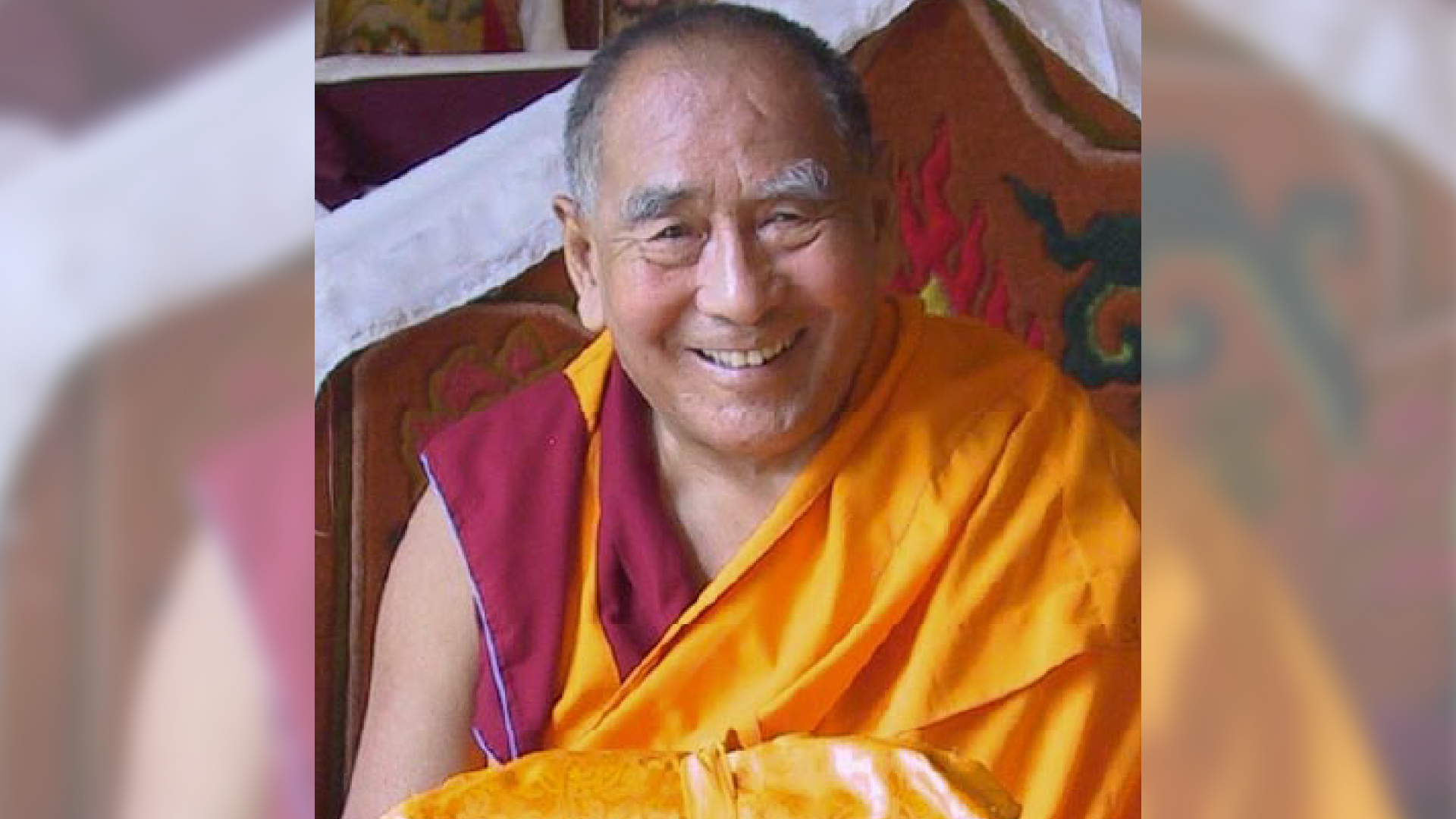 Geshe Lhundub Sopa is seated and smiling.