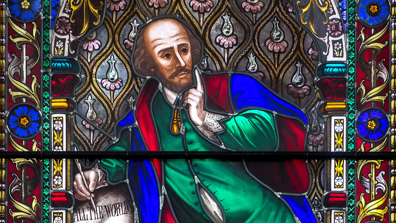 A stained glass image of poet William Shakespeare.