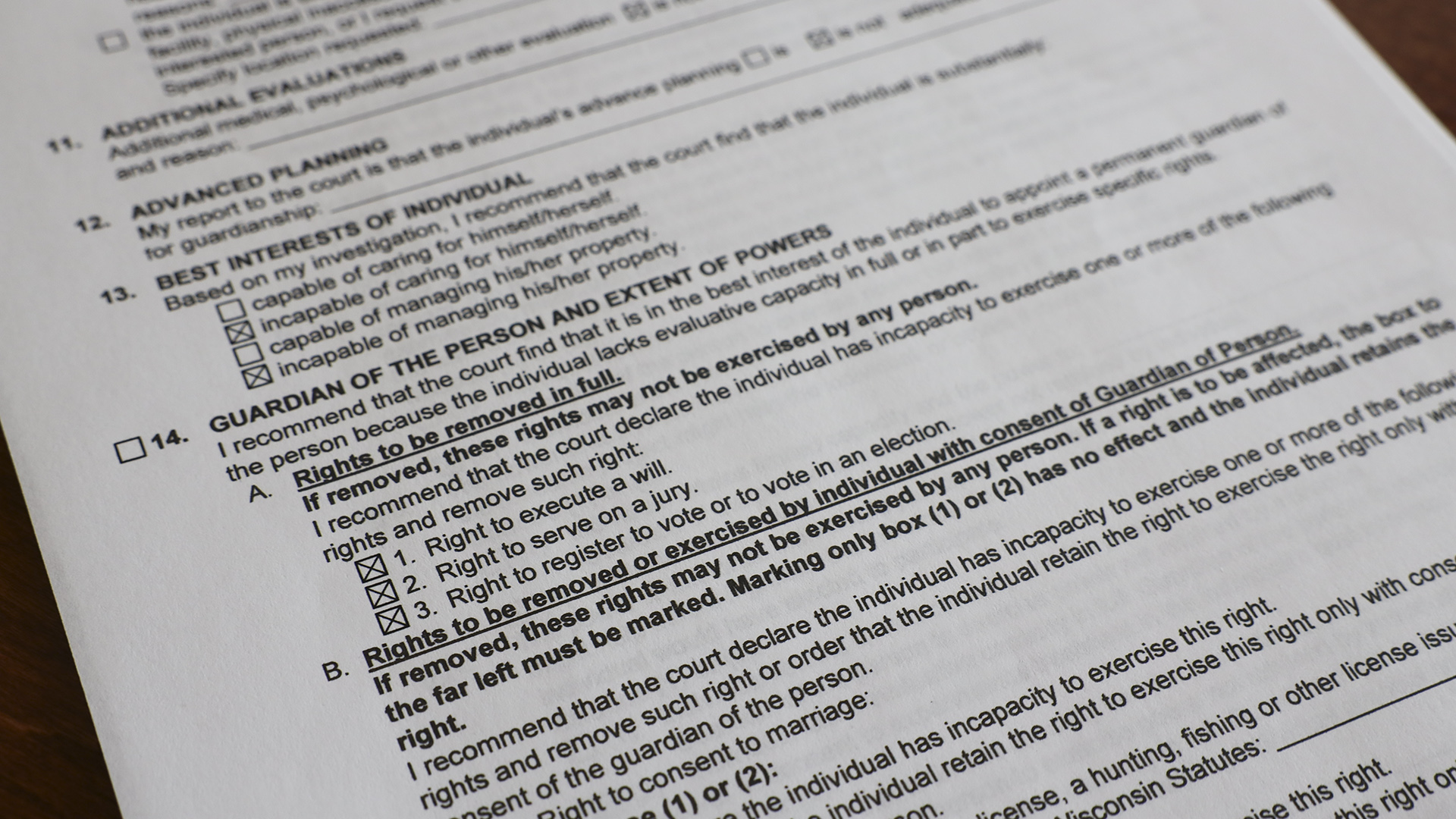 One page of a government form shows a numbered list that includes point 14., which includes checkboxes for rights that cam be removed, including executing a will, serving on a jury, and registering to vote and voting in an election.