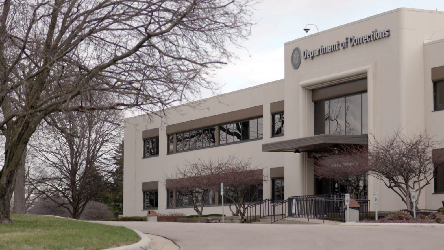 A driveway in front of the Wisconsin Department of Corrections headquarters stands empty on April 14, 2022. Wisconsin’s parole commission would be forced to post its decisions online about who has been granted and denied parole under a Republican-authored bill up for approval in the state Senate on June 7, 2023.   (Credit: PBS Wisconsin)