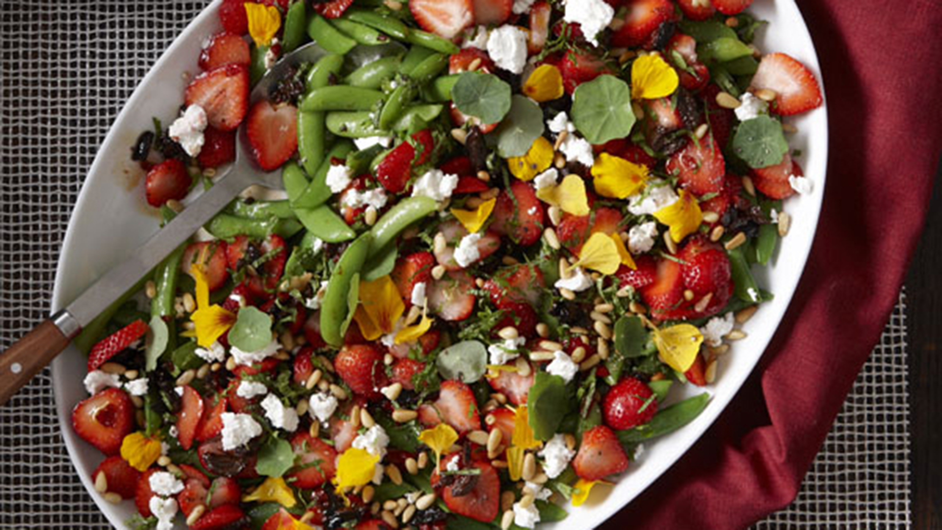 Serving platter filled with salad.