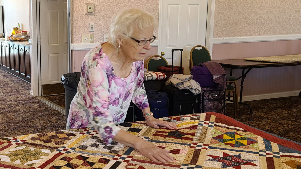 Hansen judging a quilt