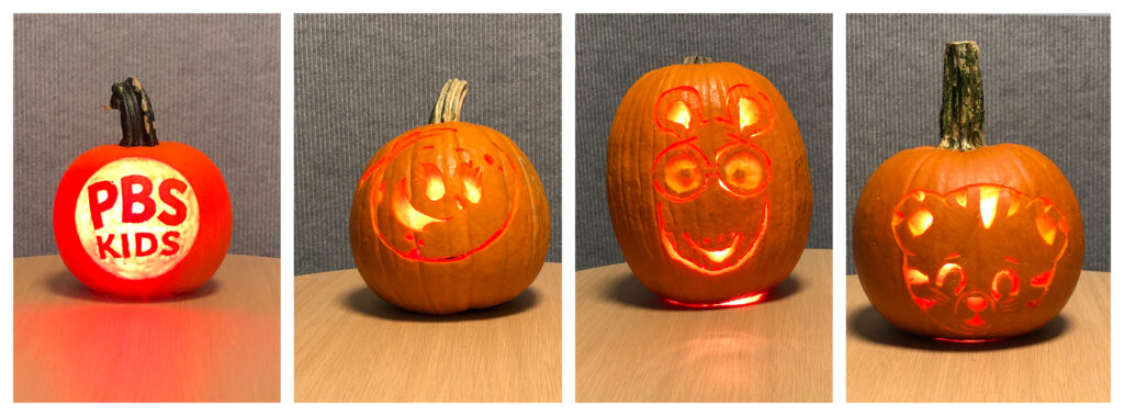 Four jack-o-lanterns are carved with the PBS KIDS logo and PBS KIDS characters.