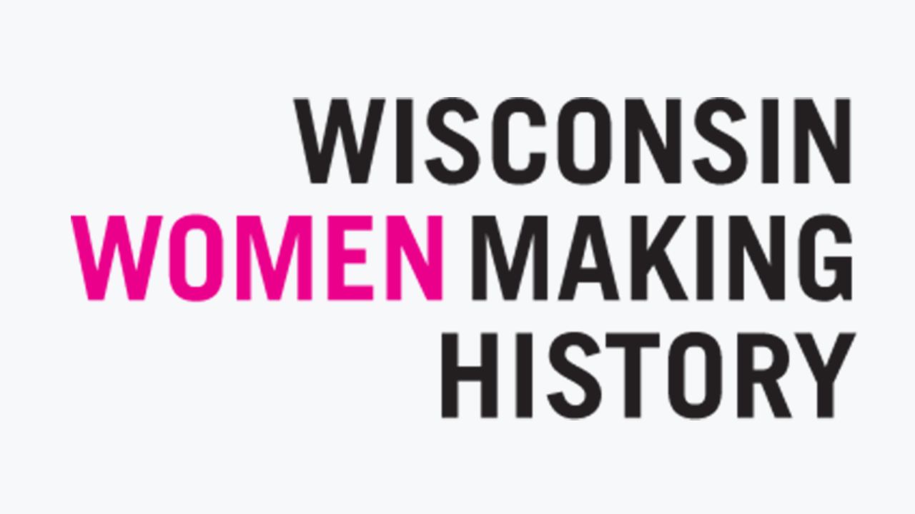 Typographical logo in sans serif text that reads, in all caps, "Wisconsin Women Making History." The logo is in black type with the exception of "WOMEN" which is in pink.