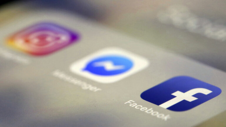 A close-up image of the screen of a smart phone shows out-of-focus app icons for Instagram and Messenger, and an in-focus app icon for Facebook.