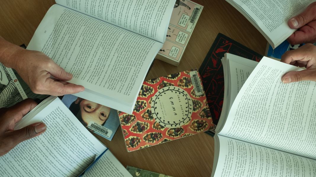 Overhead view of books on a table.