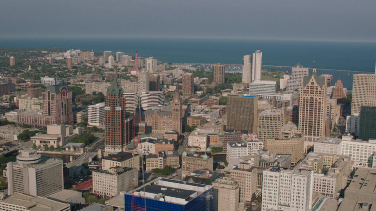 A skyline shot of Milwaukee with Lake Michigan in the background.