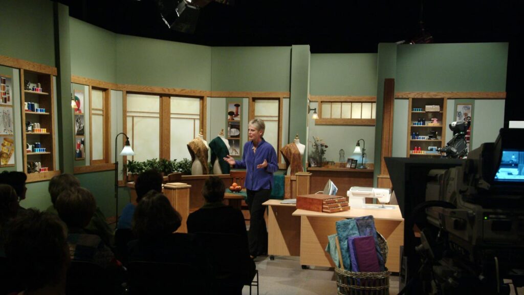 Nancy Zieman addresses an audience in the "Sewing With Nancy" studio.