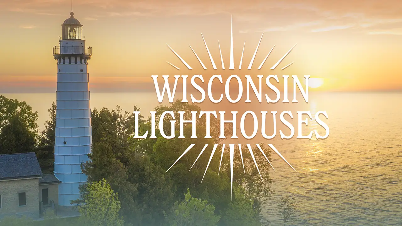 Lighthouse with trees in the foreground and a "Wisconsin Lighthouses" text overlay against a sunset over a lake.