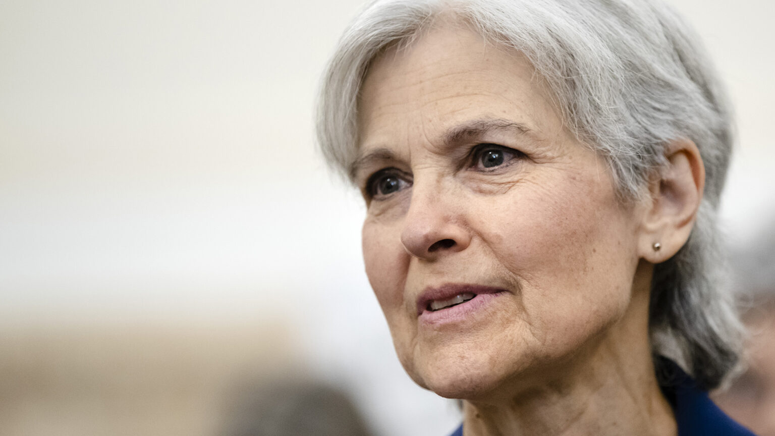 Jill Stein speaks while seated inside.