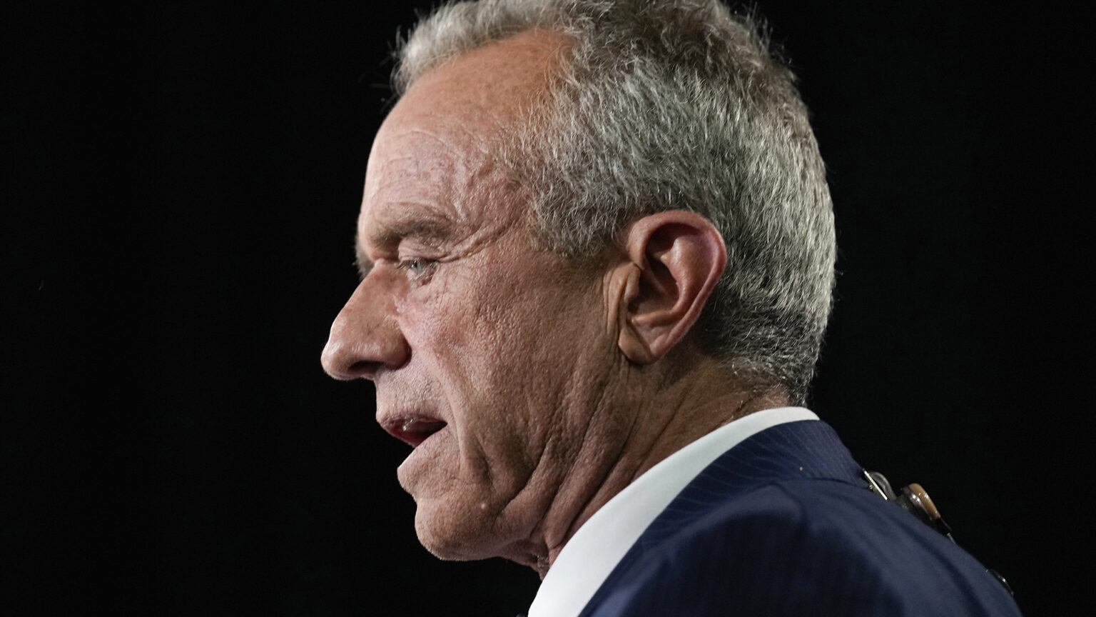 Robert F. Kennedy, Jr. is seen in profile while speaking.